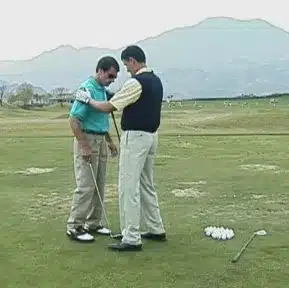 Charles Kallassy instructing blind golfer and United States Marine Corps veteran Bob Andrews at PGA West