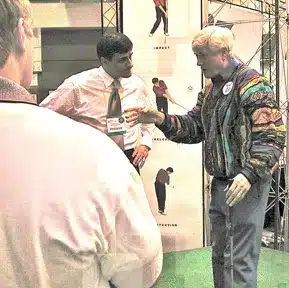 Charles Kallassy on stage with Doug Sanders at the 2000 PGA Show
