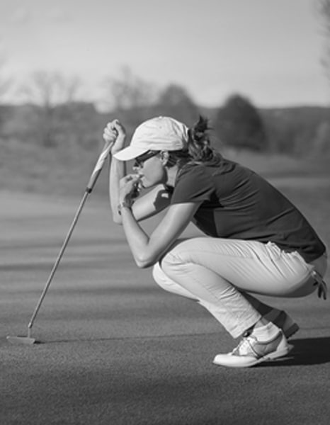 Charles Kallassy studying a golf shot on the practice ground
