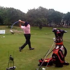 Charles Kallassy following through during a long-drive exhibition