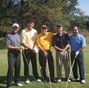 Charles Kallassy at a golf exhibition with NASCAR champion Michael Waltrip