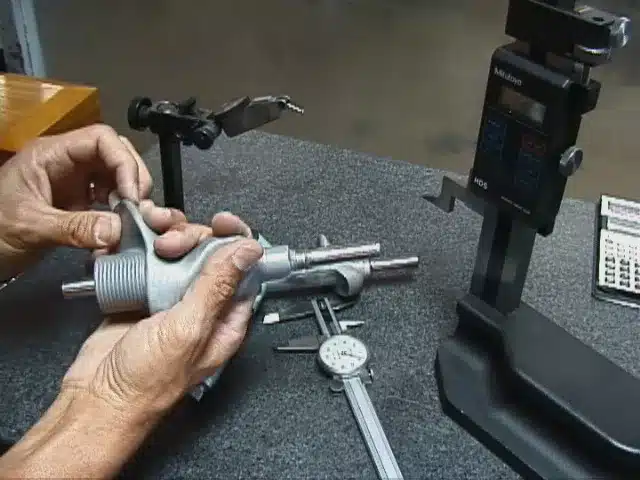 Charles Kallassy developing the Swing Magic golf trainer at a workbench