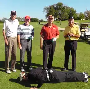 Charles Kallassy doing push-ups for four United States Marine Corps generals