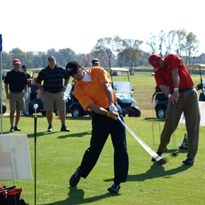 Charles Kallassy in a long-drive exhibition with Zac Adams